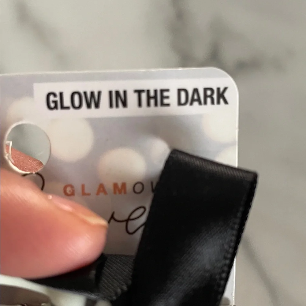 These are Scunci Glamoween Glow-in-the-Dark Skeleton Hand Hair Clips Halloween